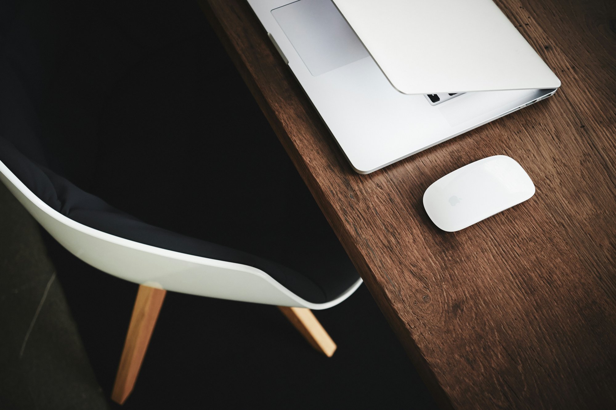 white mac on brown desk..luca-bravo-ujhKqutt3f0-unsplash